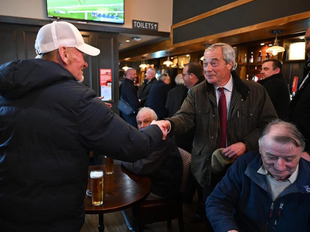 Nigel Farage meeting people in a pub in Shettleston in Glasgow
