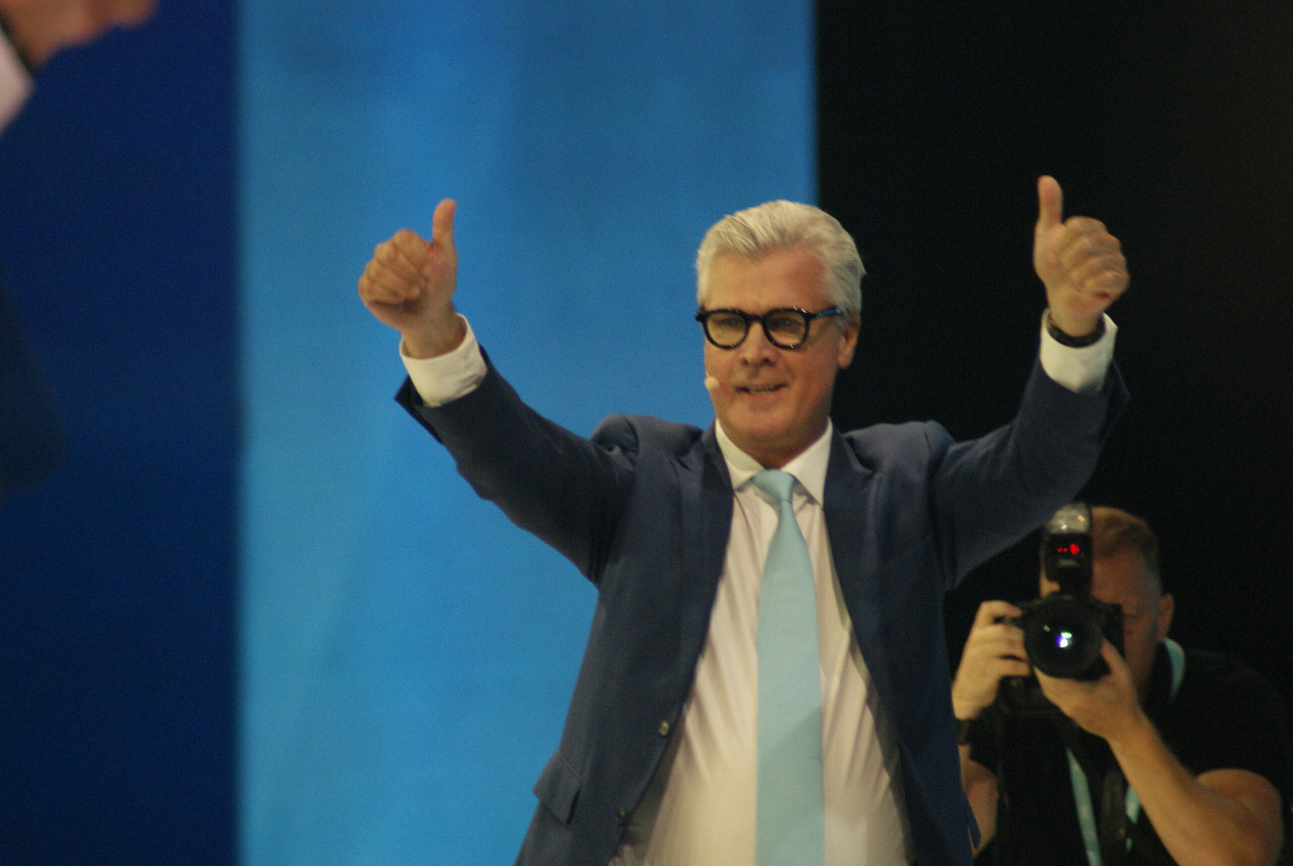 Malcolm Offord gives two thumbs up on stage at Reform UK Conference 2026 after his keynote speech.