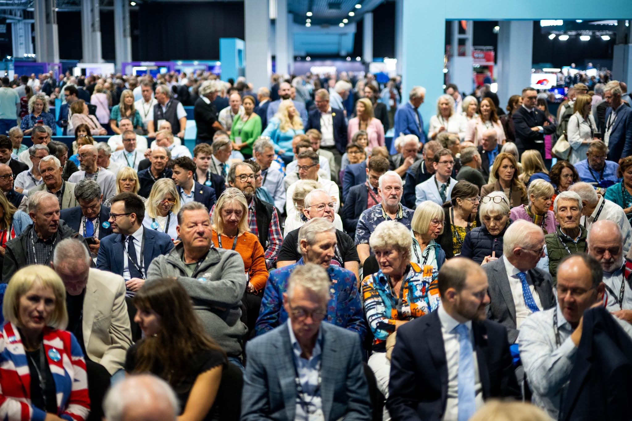 Delegates seated in the packed Reform UK Conference 2026 auditorium at the Birmingham NEC.